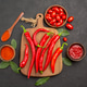 top view a bowl of cherry tomatoes hot red peppers on the chopping board a wooden spoon bay leaves top view a bowl of cherry tomatoes hot red peppers on the chopping board a wooden spoon bay leaves - PhotoDune Item for Sale