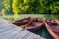 Boats in Plitvice lakes, Croatia. National Park in summer. Lakes among the forest. Boats for relax. Boats in Plitvice lakes, Croatia. National Park in summer. Lakes among the forest. Boats for relax. - PhotoDune Item for Sale