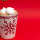 Christmas poster. A cup of hot chocolate and marmalade stand on a red background. Christmas poster. A cup of hot chocolate and marmalade stand on a red background. - PhotoDune Item for Sale