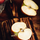 Halved Red Apple on Cutting Board Halved Red Apple on Cutting Board - PhotoDune Item for Sale