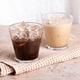 Iced coffee and black coffee served in clear glasses on beige stone table Iced coffee and black coffee served in clear glasses on beige stone table - PhotoDune Item for Sale