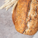 Loaf of artisan sourdough bread with wheat ears and linen napkin Loaf of artisan sourdough bread with wheat ears and linen napkin - PhotoDune Item for Sale