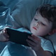 Child Using Smartphone in Bed Showing Gadget Addiction Child Using Smartphone in Bed Showing Gadget Addiction - PhotoDune Item for Sale