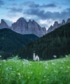 Church in Santa Maddalena village in the Dolomite Alps, Italy. Natural landscape in the mountains Church in Santa Maddalena village in the Dolomite Alps, Italy. Natural landscape in the mountains - PhotoDune Item for Sale