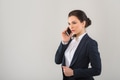 Portrait of serious pretty businesswoman talking on the phone in modern office Portrait of serious pretty businesswoman talking on the phone in modern office - PhotoDune Item for Sale