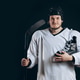 Handsome hockey player. Smiling at camera isolated on black background. Handsome hockey player. Smiling at camera isolated on black background. - PhotoDune Item for Sale