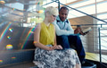 Two creative millenial small business owners working on social media strategy on a staircase Two creative millenial small business owners working on social media strategy on a staircase - PhotoDune Item for Sale