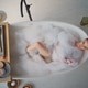Serene woman relaxing foam filled bathtub top view. Tranquil lady enjoying spa Serene woman relaxing foam filled bathtub top view. Tranquil lady enjoying spa - PhotoDune Item for Sale