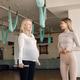Trainer helping pregnant woman to do excercises with a dumbbells Trainer helping pregnant woman to do excercises with a dumbbells - PhotoDune Item for Sale