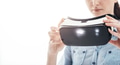 Woman holding a VR headset Woman holding a VR headset - PhotoDune Item for Sale