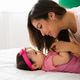 Loving mother kissing her daughter Loving mother kissing her daughter - PhotoDune Item for Sale