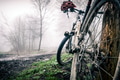 Mountain bike and helmet in autumn woods Mountain bike and helmet in autumn woods - PhotoDune Item for Sale