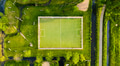 An aerial view of the football field. A soccer field in the midst of nature. An aerial view of the football field. A soccer field in the midst of nature. - PhotoDune Item for Sale