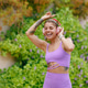 A Joyful Woman Dancing Outdoors in a Stylish and Colorful Workout Outfit Full of Energy A Joyful Woman Dancing Outdoors in a Stylish and Colorful Workout Outfit Full of Energy - PhotoDune Item for Sale
