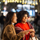 Diverse women friends enjoying christmas shopping in city night Diverse women friends enjoying christmas shopping in city night - PhotoDune Item for Sale