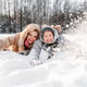 Resting mother with teen son on soft snow, faces close, smiling after winter games. Warm family Resting mother with teen son on soft snow, faces close, smiling after winter games. Warm family - PhotoDune Item for Sale