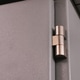 Selective focus on close up image of electrical cabinet door with hinges. Selective focus on close up image of electrical cabinet door with hinges. - PhotoDune Item for Sale