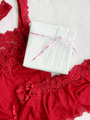 Flat lay of red woman’s lace lingerie set & a white wrapped present with a happy valentines bow Flat lay of red woman’s lace lingerie set & a white wrapped present with a happy valentines bow - PhotoDune Item for Sale