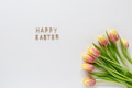 Easter greeting card template with Happy Easter text and tulips on white background Easter greeting card template with Happy Easter text and tulips on white background - PhotoDune Item for Sale