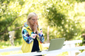 Excited desperate stressed business woman standing in city park and looking at laptop screen Excited desperate stressed business woman standing in city park and looking at laptop screen - PhotoDune Item for Sale