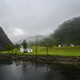 Small White House in a Rural Norwegian Fjord Valley Small White House in a Rural Norwegian Fjord Valley - PhotoDune Item for Sale