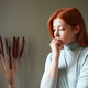 sad worried woman biting nails and contemplating depression loss and anxiety sad worried woman biting nails and contemplating depression loss and anxiety - PhotoDune Item for Sale