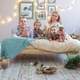 A happy family and pets in a bedroom at home on Christmas morning. New Year's. A happy family and pets in a bedroom at home on Christmas morning. New Year's. - PhotoDune Item for Sale