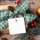 Christmas square gift tag mockup with present box on rustic background Christmas square gift tag mockup with present box on rustic background - PhotoDune Item for Sale