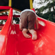 barefoot child climbs a slide in the playground barefoot child climbs a slide in the playground - PhotoDune Item for Sale