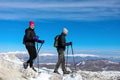 Hikers walk with snowshoes to the snow-capped peak Hikers walk with snowshoes to the snow-capped peak - PhotoDune Item for Sale