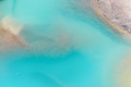Clear azure water in a mountain lake. The shore with stones. View of the water from a drone. Clear azure water in a mountain lake. The shore with stones. View of the water from a drone. - PhotoDune Item for Sale