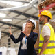Female manager talking with foreman. Warehouse, production worker preparing products for shipment Female manager talking with foreman. Warehouse, production worker preparing products for shipment - PhotoDune Item for Sale