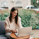 Woman working on a laptop at a cafe, sipping coffee by a window for a calm, productive scene Woman working on a laptop at a cafe, sipping coffee by a window for a calm, productive scene - PhotoDune Item for Sale