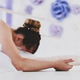 Professional young ballerina in white tutu is stretching while sitting on the floor in ballet class Professional young ballerina in white tutu is stretching while sitting on the floor in ballet class - PhotoDune Item for Sale