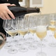 The waiters pouring champagne at a wedding The waiters pouring champagne at a wedding - PhotoDune Item for Sale