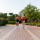 Two Energetic Young Women Running in the Park Two Energetic Young Women Running in the Park - PhotoDune Item for Sale