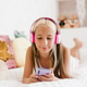 Teenage girl is relaxing in bed using touchscreen smartphone Teenage girl is relaxing in bed using touchscreen smartphone - PhotoDune Item for Sale