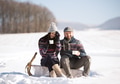Young woman and man with cup of coffee in winter nature. Young woman and man with cup of coffee in winter nature. - PhotoDune Item for Sale
