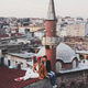 Couple in love sitting on roof with view of evening Istanbul. Casual style, autumn look, red beret Couple in love sitting on roof with view of evening Istanbul. Casual style, autumn look, red beret - PhotoDune Item for Sale