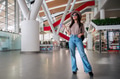 Beautiful young woman travels posing at airport during her trip Beautiful young woman travels posing at airport during her trip - PhotoDune Item for Sale