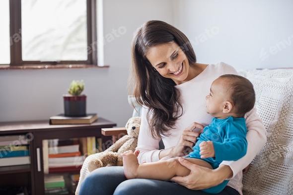 Baby on mother lap Stock Photo by Rido81 PhotoDune