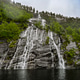 Dramatic Waterfall Cascading into Norwegian Fjord Dramatic Waterfall Cascading into Norwegian Fjord - PhotoDune Item for Sale