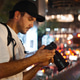 Travel photographer viewing camera in bangkok city at night Travel photographer viewing camera in bangkok city at night - PhotoDune Item for Sale