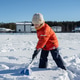 Child in winter clothes shoveling snow outdoors Child in winter clothes shoveling snow outdoors - PhotoDune Item for Sale