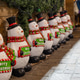 Adorable merry Christmas snowman figurines lined up at Gent Christmas market festival. Adorable merry Christmas snowman figurines lined up at Gent Christmas market festival. - PhotoDune Item for Sale