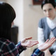 Desperate gestures - young woman at a counselling session with a therapist Desperate gestures - young woman at a counselling session with a therapist - PhotoDune Item for Sale