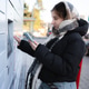 Young Girl Uses Smartphone To Open Outdoor Parcel Locker Young Girl Uses Smartphone To Open Outdoor Parcel Locker - PhotoDune Item for Sale