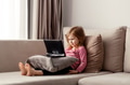Cute todller girl sitting on couch, using tablet pad laptop gadget, watching cartoons at home Cute todller girl sitting on couch, using tablet pad laptop gadget, watching cartoons at home - PhotoDune Item for Sale
