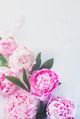Minimal styled flatlay with peony flowers, petals and leaves on a pastel background with copy space Minimal styled flatlay with peony flowers, petals and leaves on a pastel background with copy space - PhotoDune Item for Sale