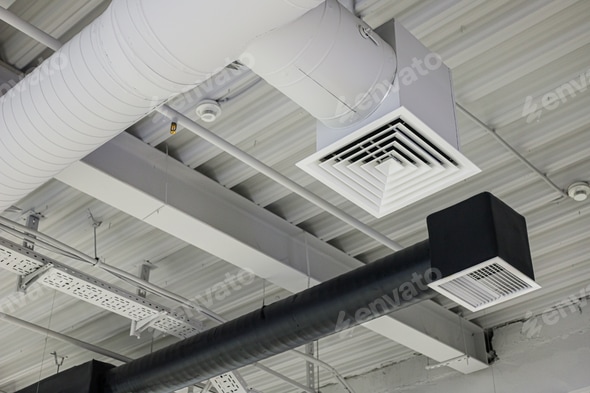Two ventilation duct systems with grilles under ceiling in